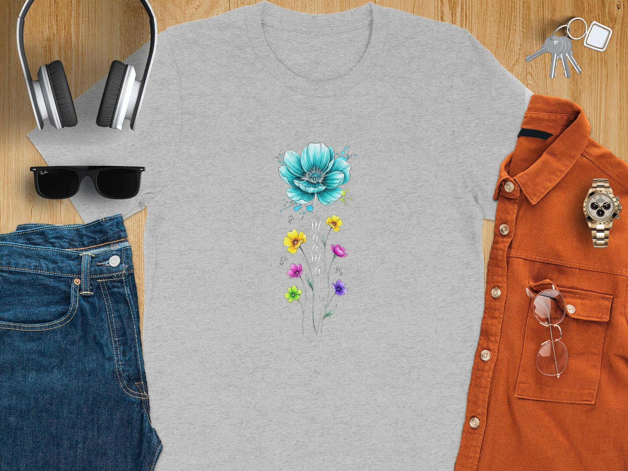 Grey t-shirt with blue and multi-colored floral "mama" design.