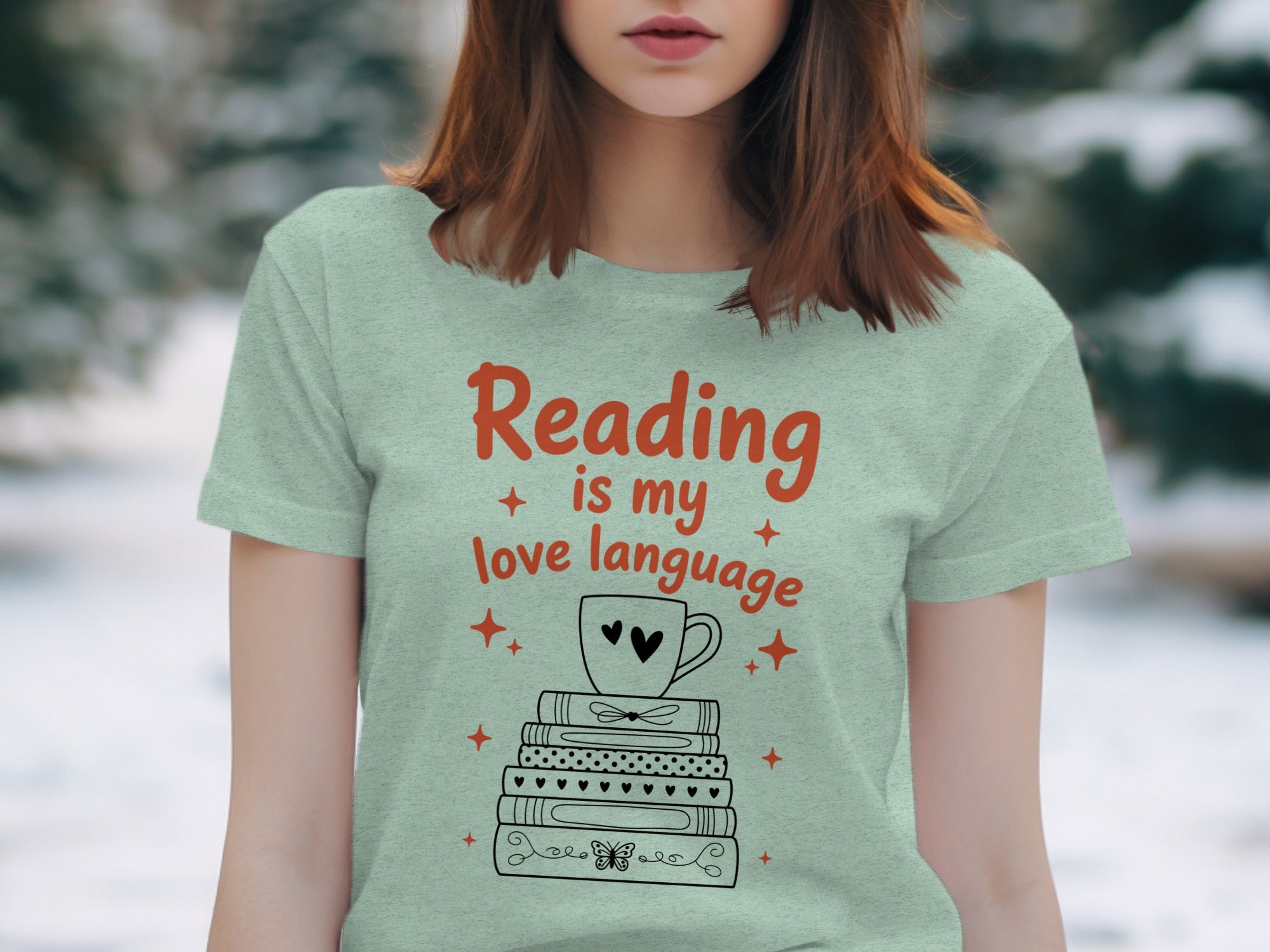 Light green t-shirt graphic with "Reading is my love language" and stacked books.