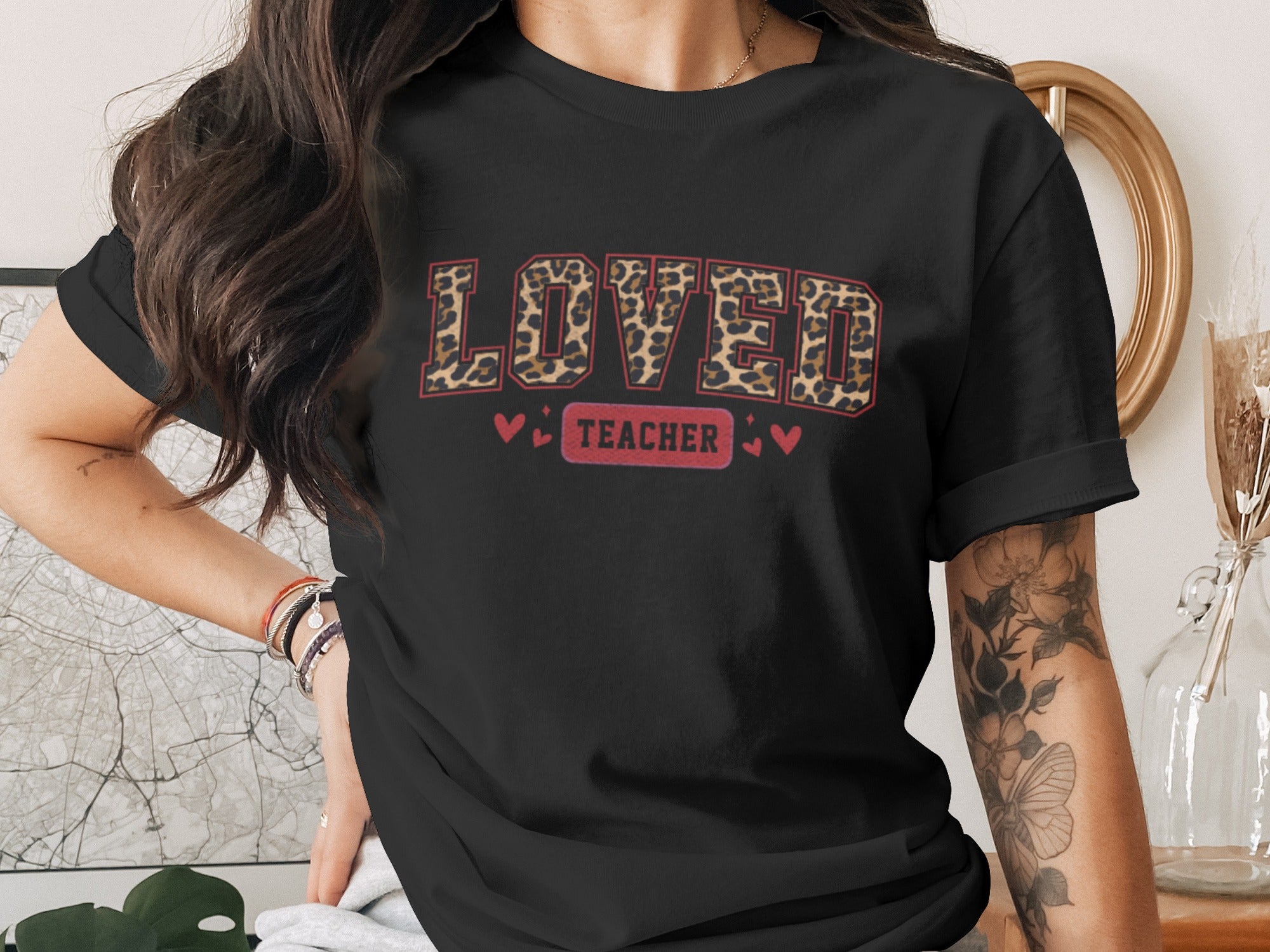 Black t-shirt with leopard print "LOVED TEACHER" text and hearts.
