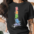 Stack of colorful cartoon cats with glasses and a ball of yarn.