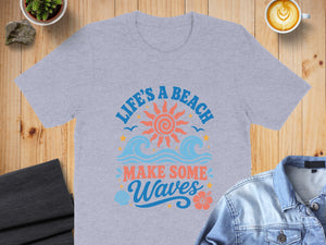Grey t-shirt with "Life's a Beach Make Some Waves" text and beach graphics.