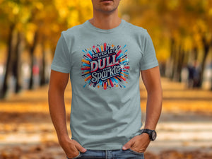 Light blue t-shirt with "NEVER LET ANYONE DULL YOUR SPARKLE" graphic.