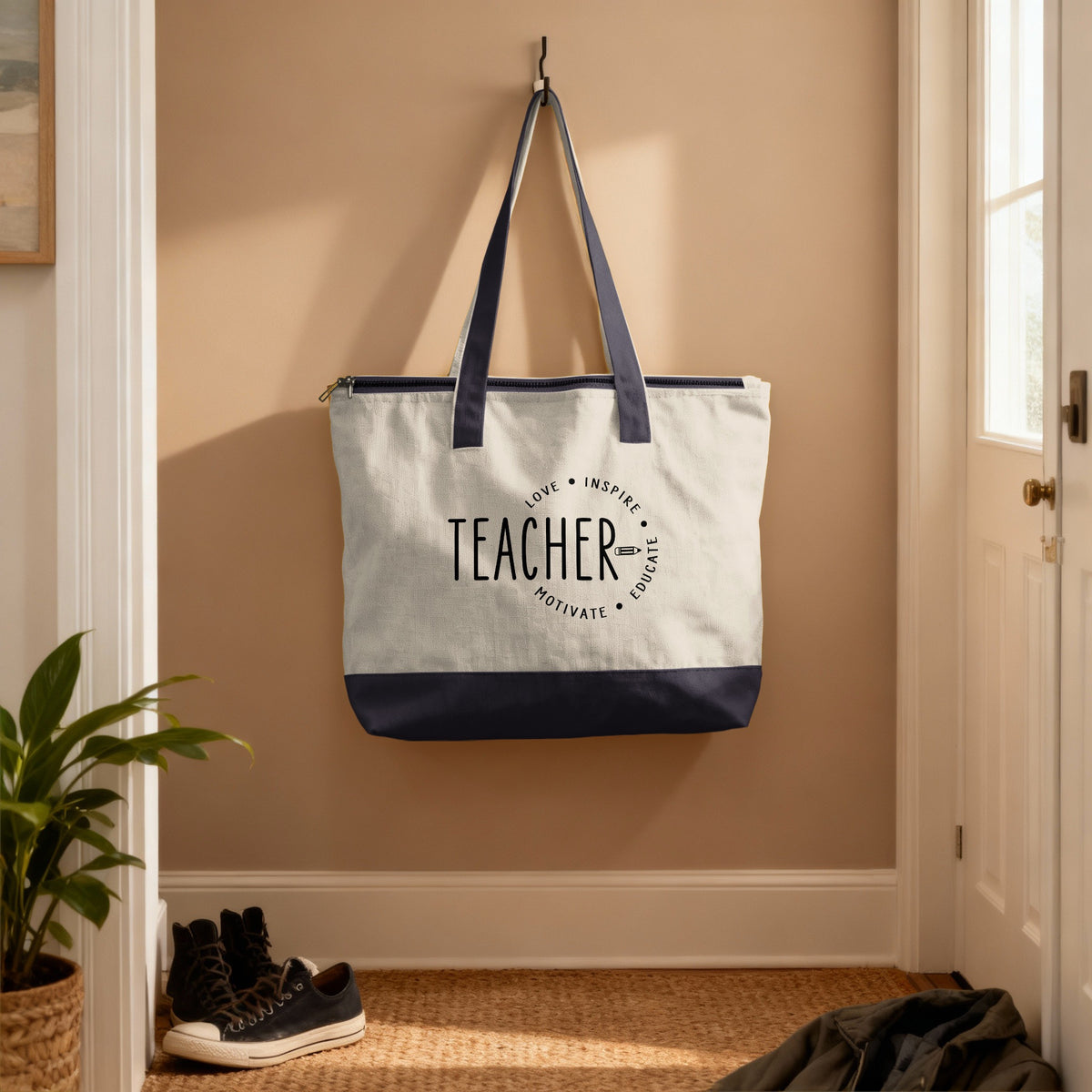 Teacher tote bag with love, inspire, educate, motivate text and pencil graphic.
