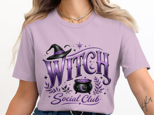 Lavender t-shirt with "WITCH Social Club" graphic, witch hat, and cauldron.