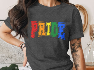 Dark grey t-shirt with colorful "PRIDE" text in rainbow colors.