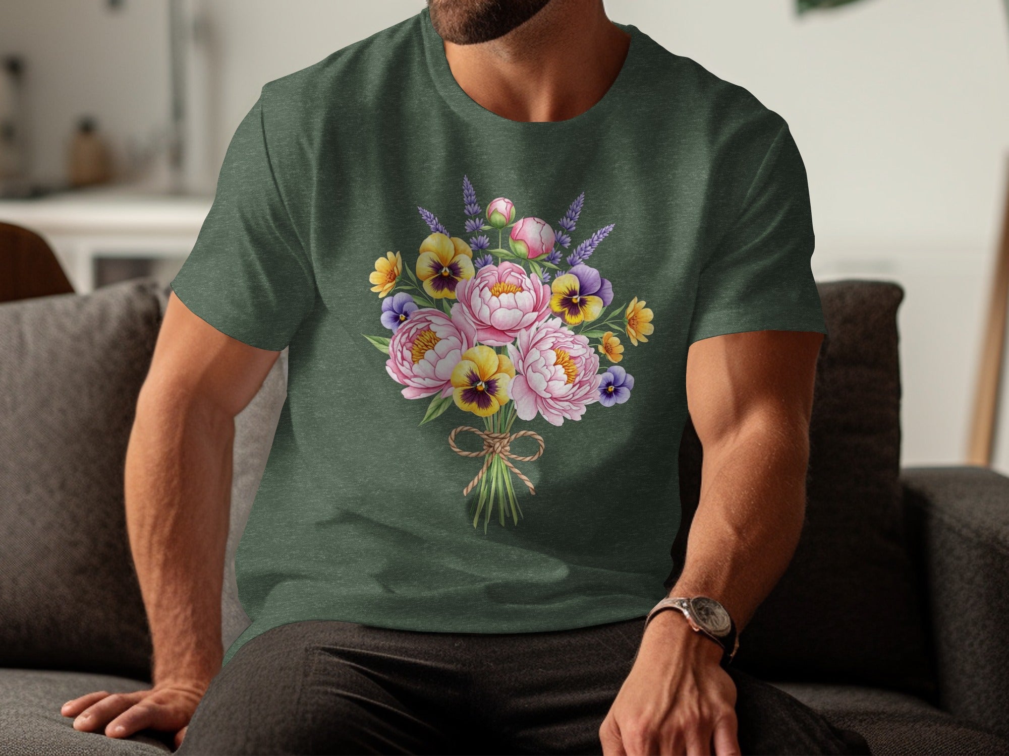 Green t-shirt with a watercolor bouquet of pink peonies, yellow pansies, and lavender sprigs.