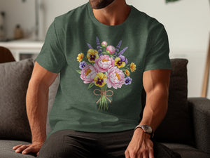 Green t-shirt with a watercolor bouquet of pink peonies, yellow pansies, and lavender sprigs.