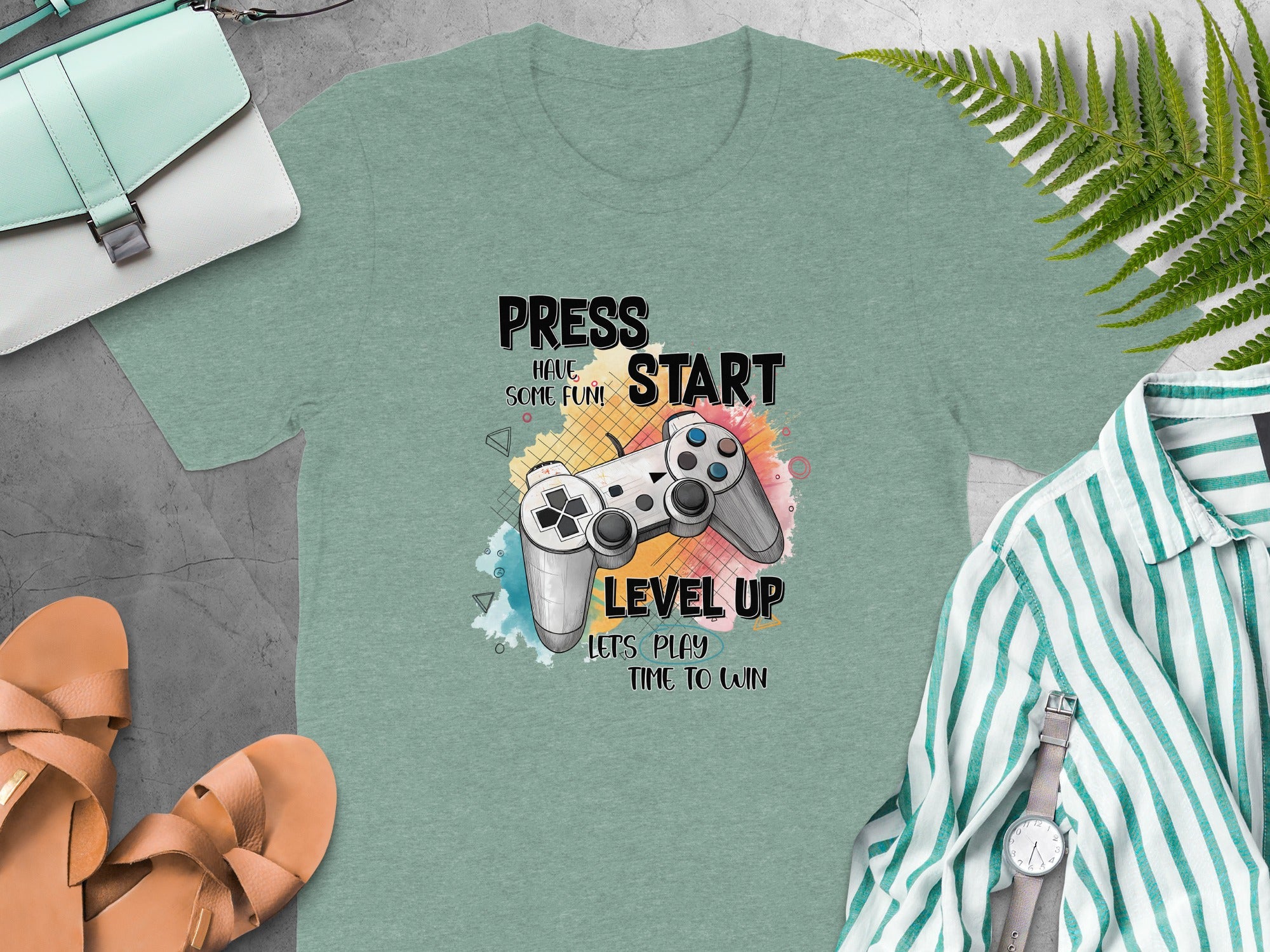 T-shirt with a video game controller graphic and text reading "Press Start," "Have Some Fun!," "Level Up," and "Let's Play Time to Win."
