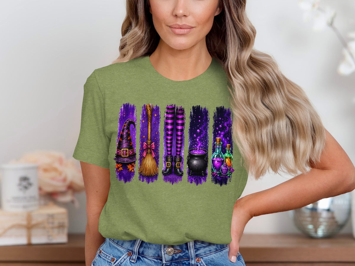 Witch hat, broom, striped stockings, cauldron, and potion bottles graphic on a green t-shirt.