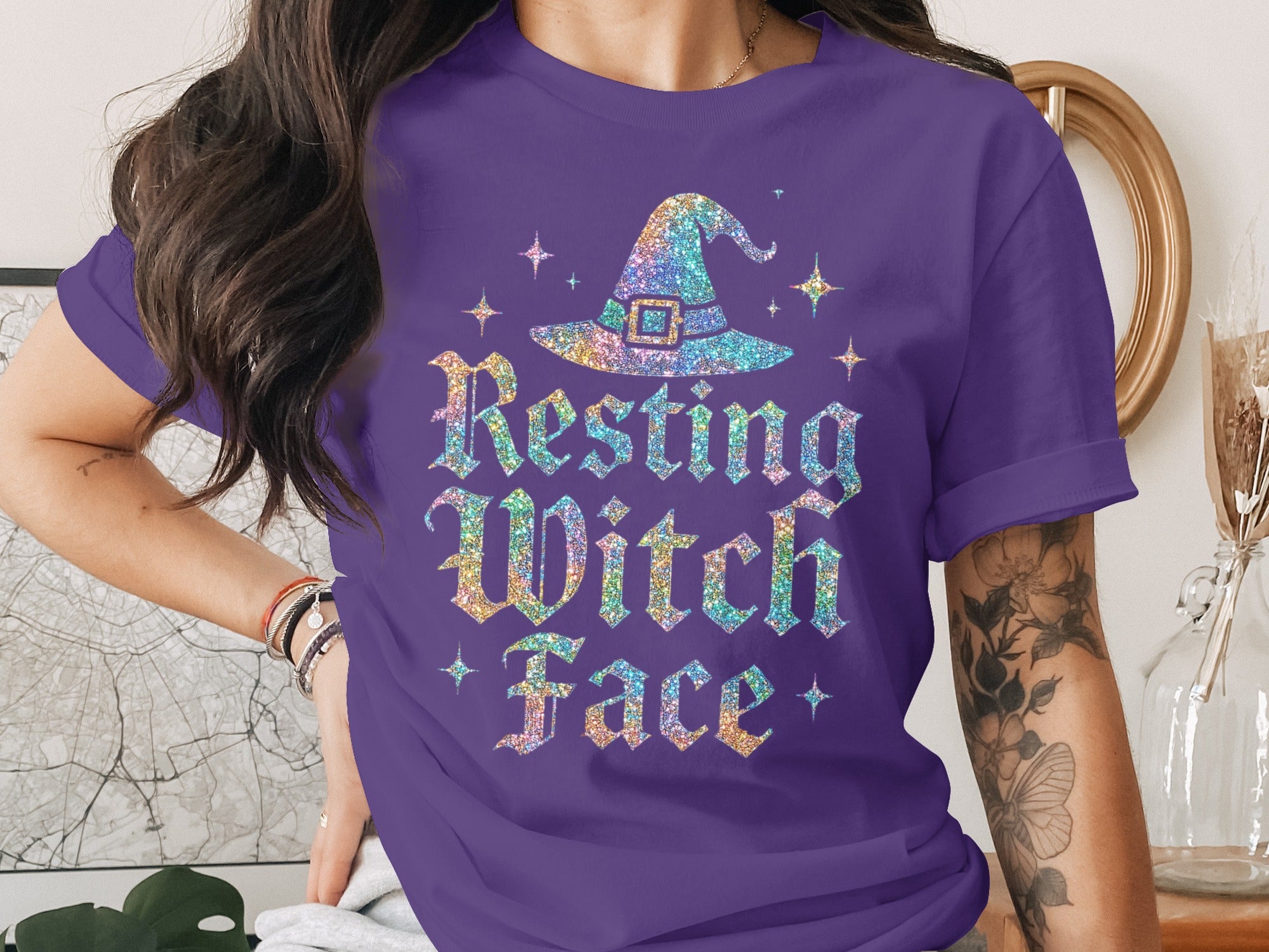 Purple t-shirt with glittery witch hat and "Resting Witch Face" text.