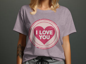 Pink heart graphic with "I LOVE YOU" text on a lilac t-shirt.