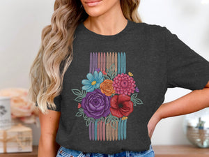 Dark grey t-shirt with colorful floral bouquet design over striped background colors.