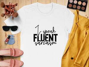 White t-shirt with "I speak FLUENT sarcasm" text, styled with makeup and clothing items.