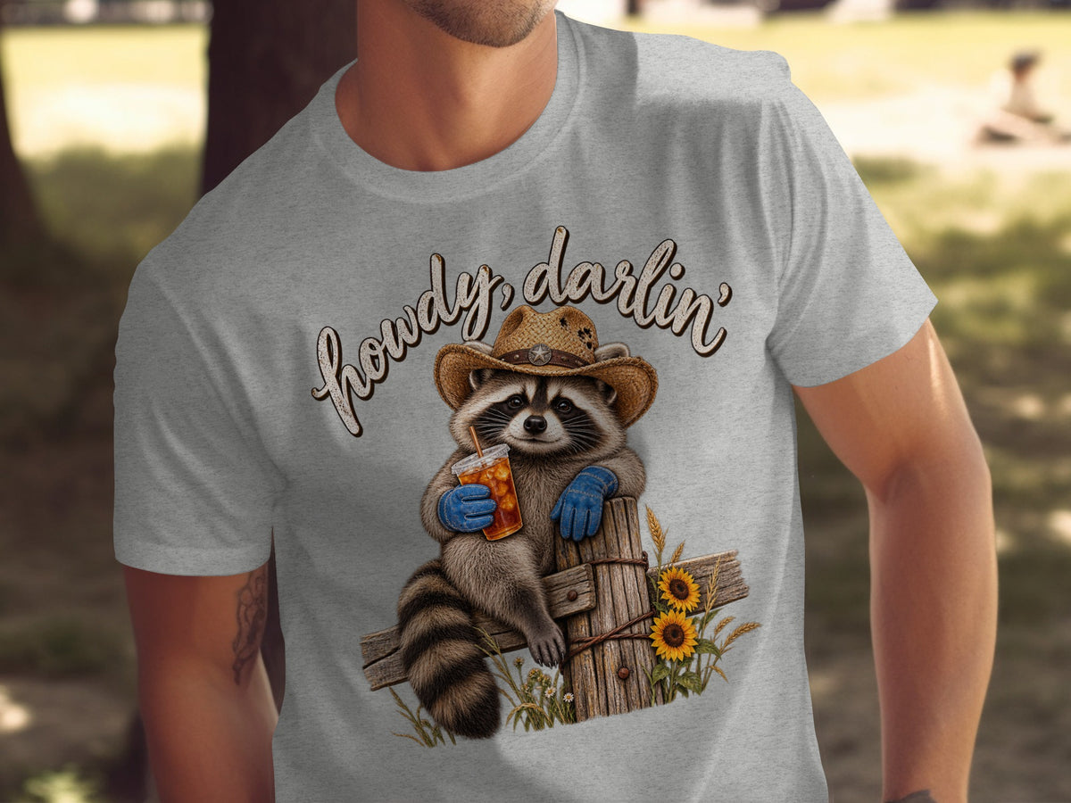 Raccoon in cowboy hat holding iced tea, with "howdy, darlin'" text above.