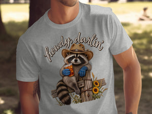 Raccoon in cowboy hat holding iced tea, with "howdy, darlin'" text above.