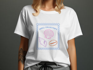 White t-shirt with a blue stamp design featuring "Shell Collector's" and three shells.