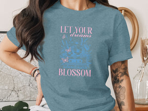 T-shirt with "Let Your Dreams Blossom" text, flowers, butterflies, and cassette tape graphic.