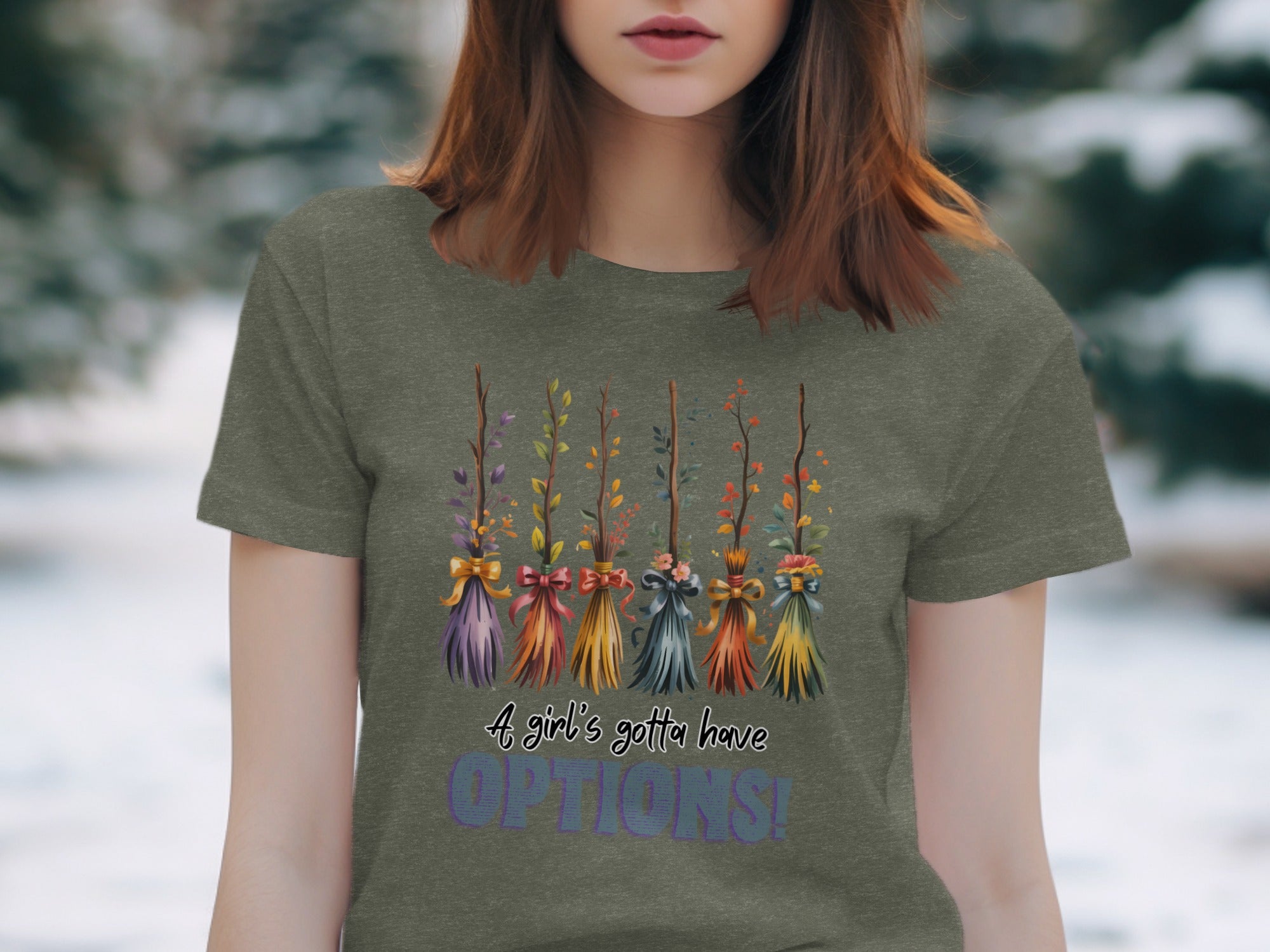 T-shirt with colorful brooms and text, "A girl's gotta have OPTIONS!"