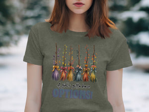 T-shirt with colorful brooms and text, "A girl's gotta have OPTIONS!"