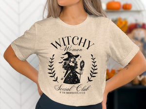 Light beige t-shirt with "Witchy Woman Social Club" text and witch graphic.