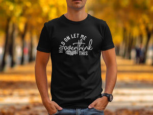 Black t-shirt with white text "Hold on let me overthink this".