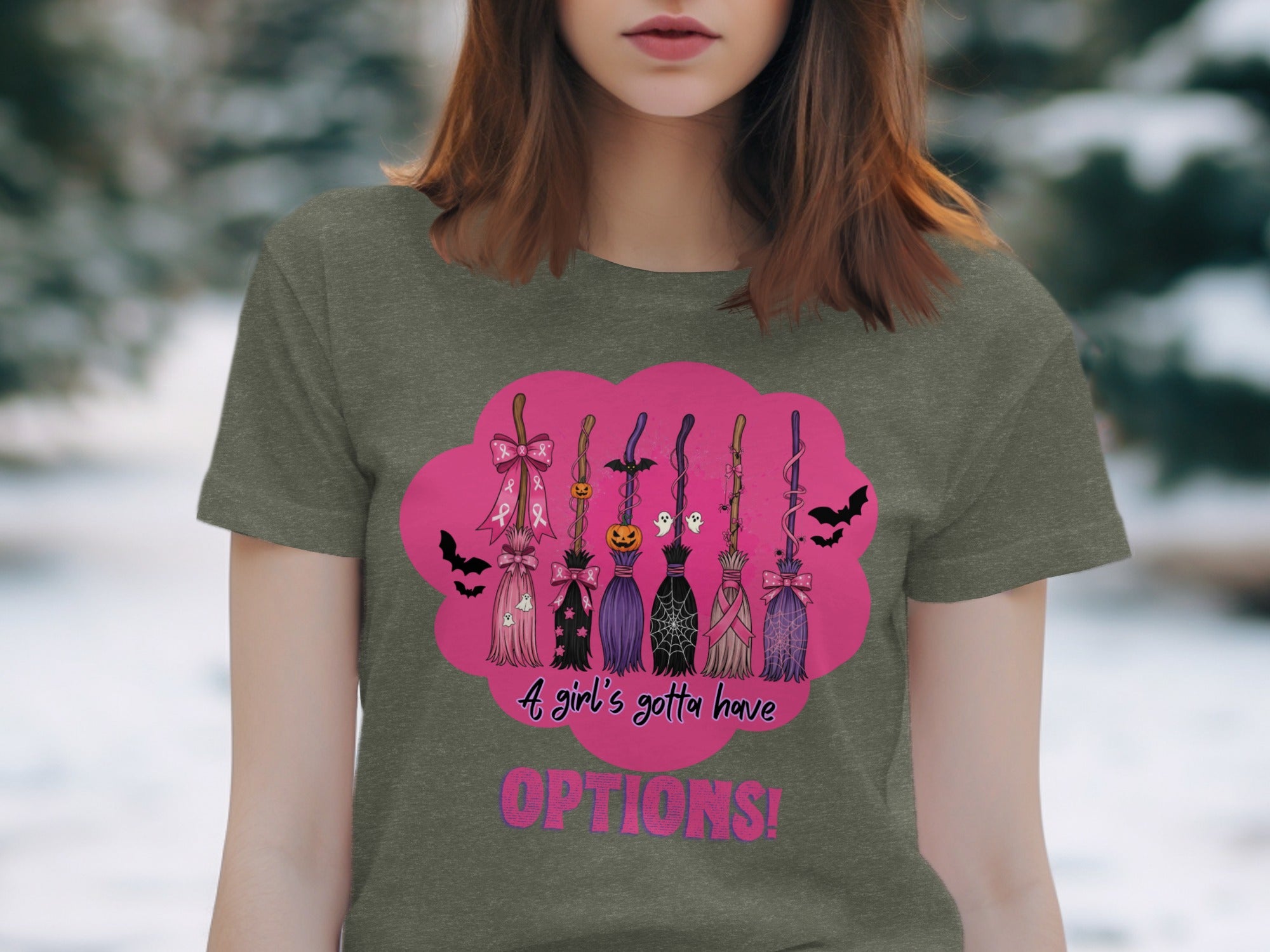 T-shirt design with multiple decorative brooms, bats, ghosts, and text.