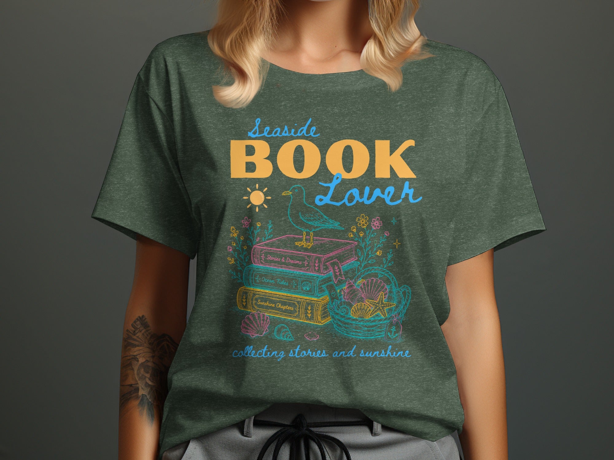Seaside BOOK Lover graphic with stacked books, seagull, sun, shells, and text.