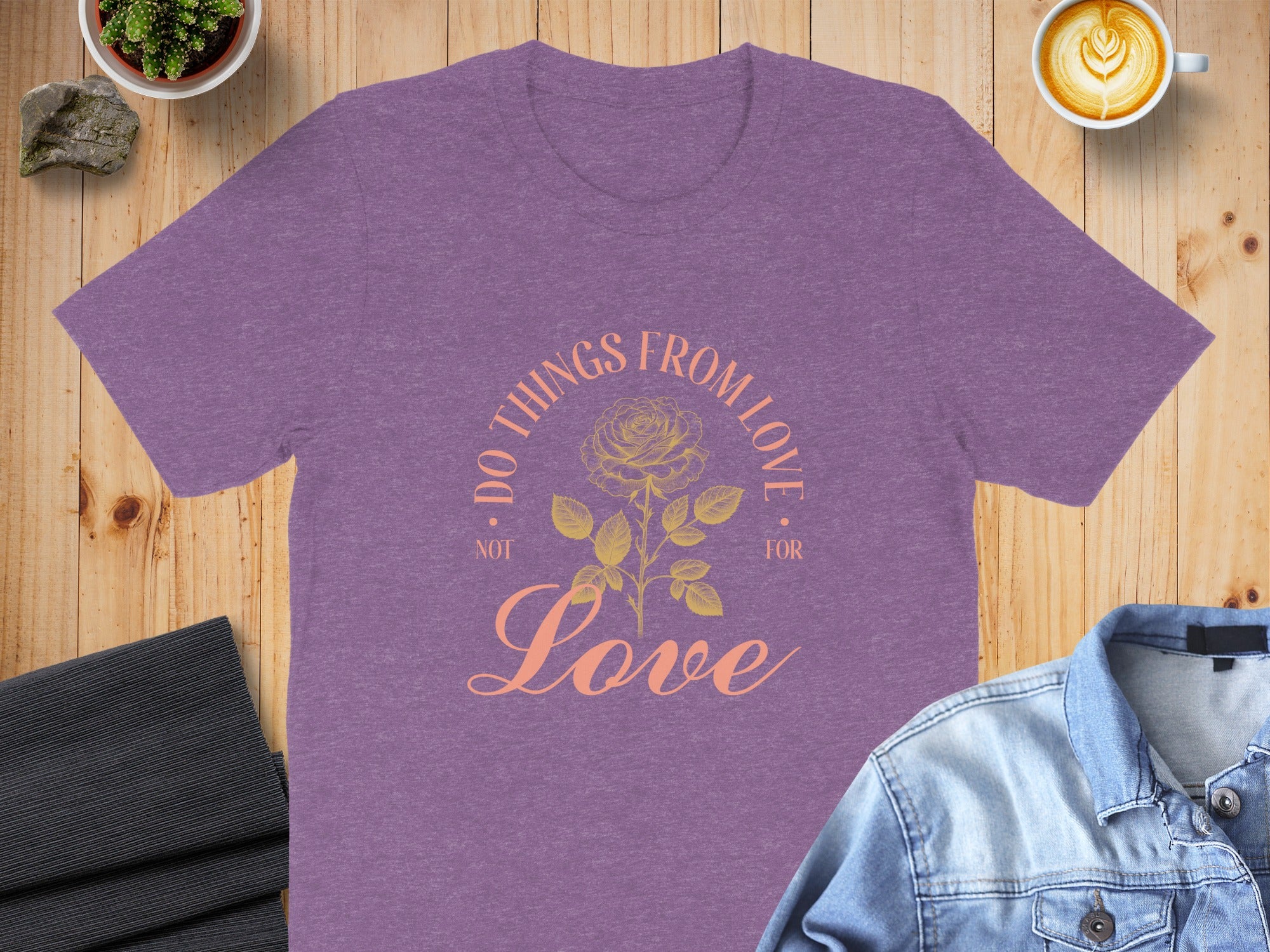 Purple t-shirt with a floral design and text "DO THINGS FROM LOVE NOT FOR LOVE".