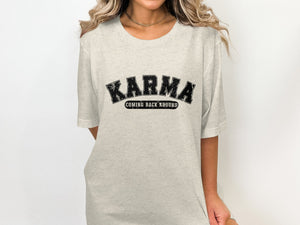 Light grey t-shirt with distressed black "KARMA COMING BACK AROUND" text