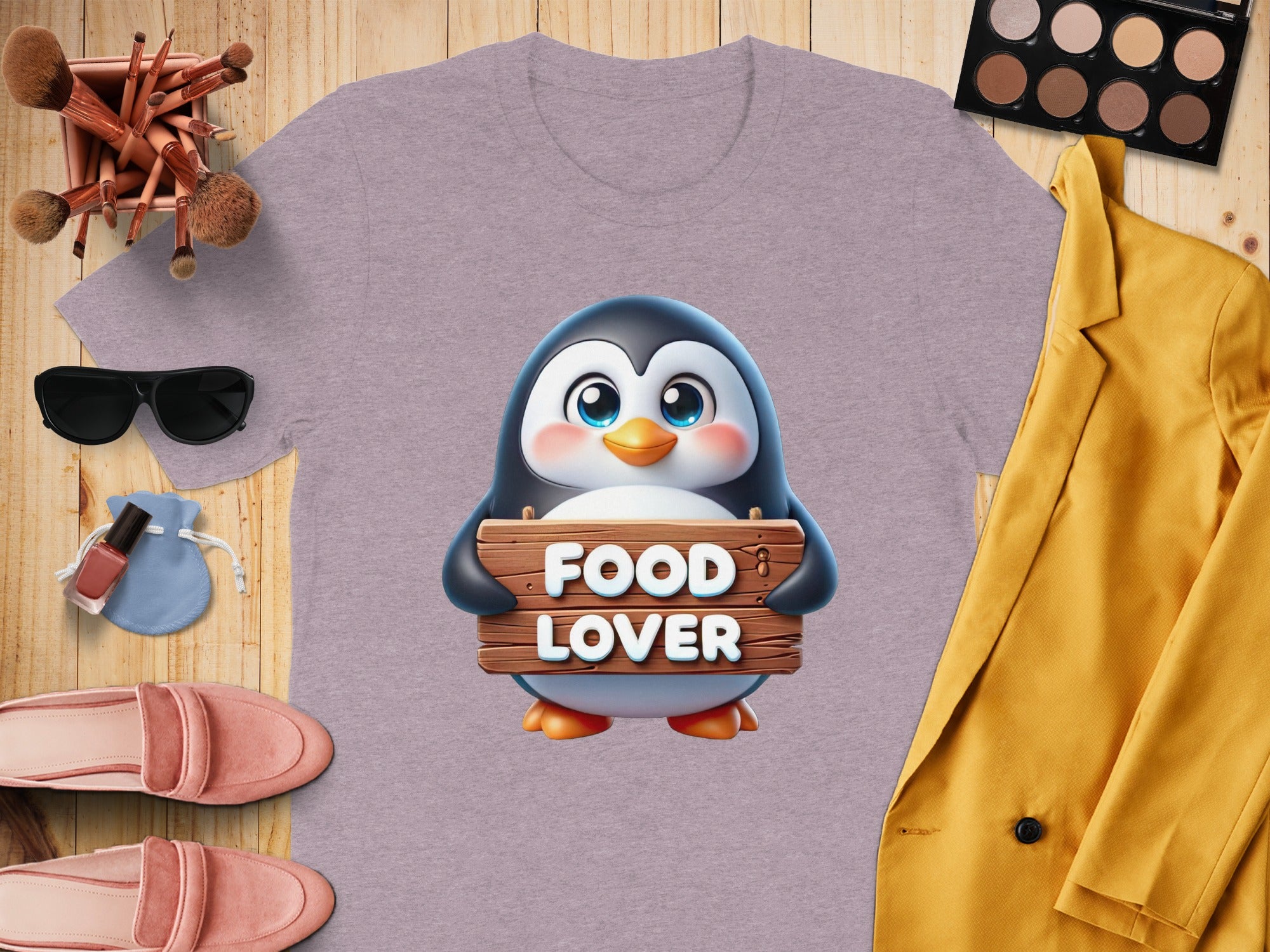 Purple t-shirt with a cute penguin holding a "FOOD LOVER" sign.
