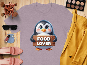 Purple t-shirt with a cute penguin holding a "FOOD LOVER" sign.