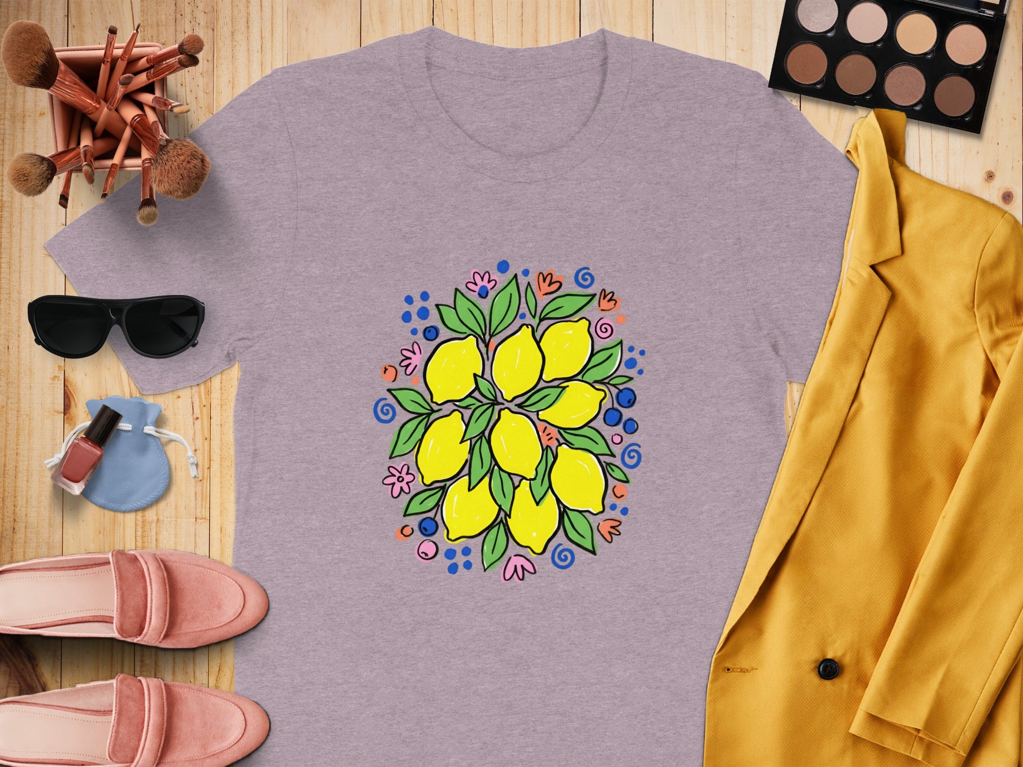 Purple t-shirt with a hand-drawn lemon and flower bouquet graphic.