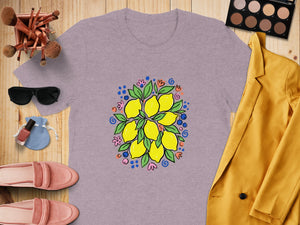 Purple t-shirt with a hand-drawn lemon and flower bouquet graphic.