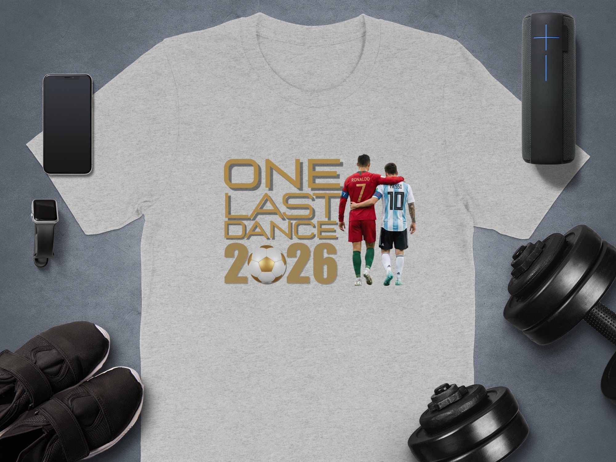 Gray t-shirt with Cristiano Ronaldo and Lionel Messi graphic and text "ONE LAST DANCE 2026".