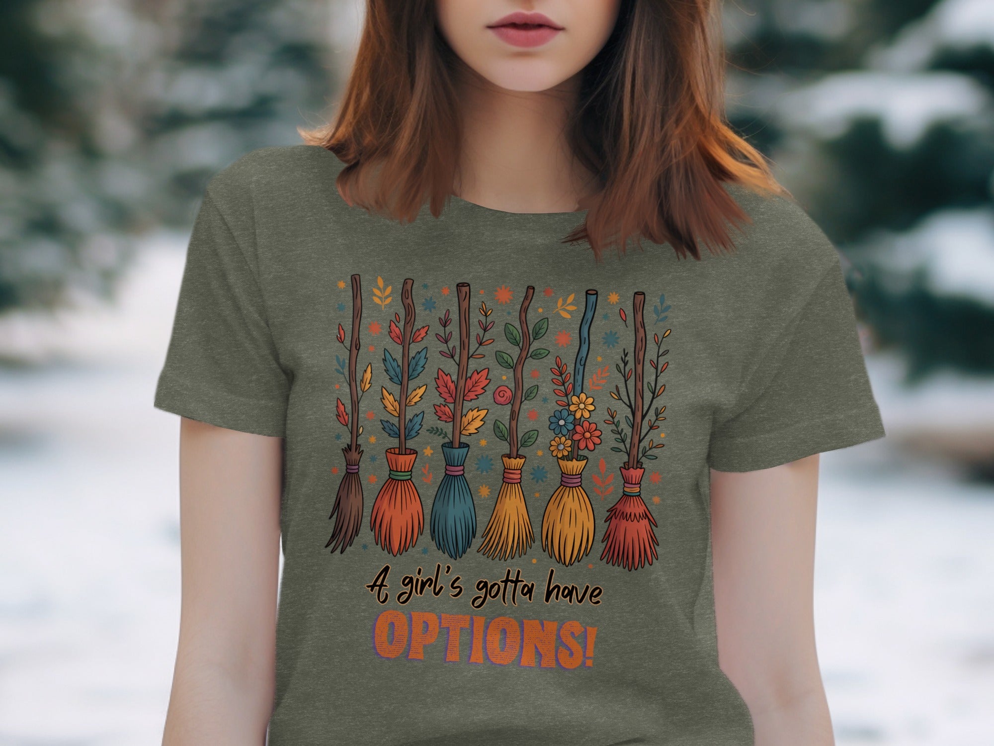 T-shirt with colorful brooms, leaves, and flowers, says "A girl's gotta have OPTIONS!"