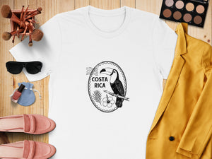 White t-shirt with Costa Rica toucan graphic, hibiscus flower, and palm frond.