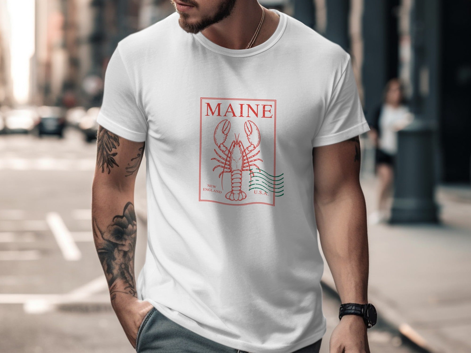 White t-shirt with red Maine lobster and text graphic.