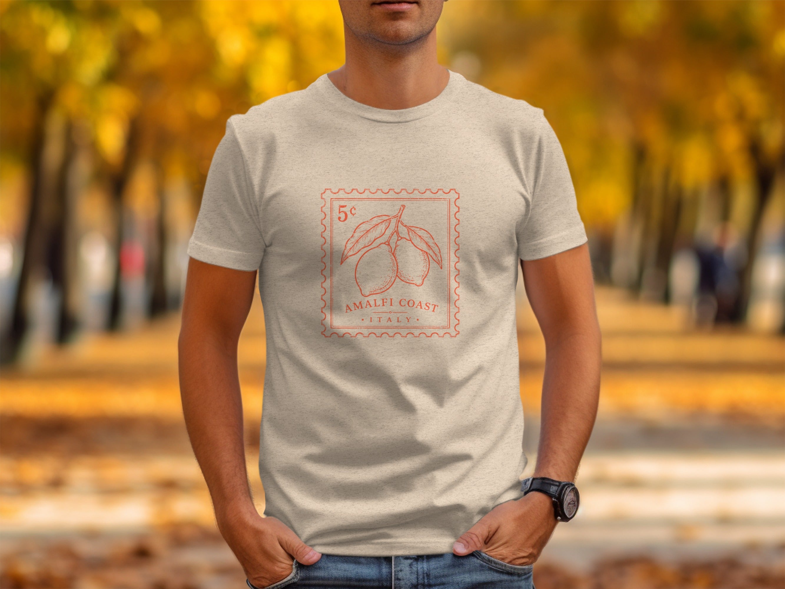 Light tan t-shirt with red stamp graphic of lemons and text "Amalfi Coast Italy".