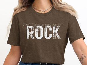 Brown t-shirt with distressed white text "jingle bells jingle bells jingle bells ROCK".