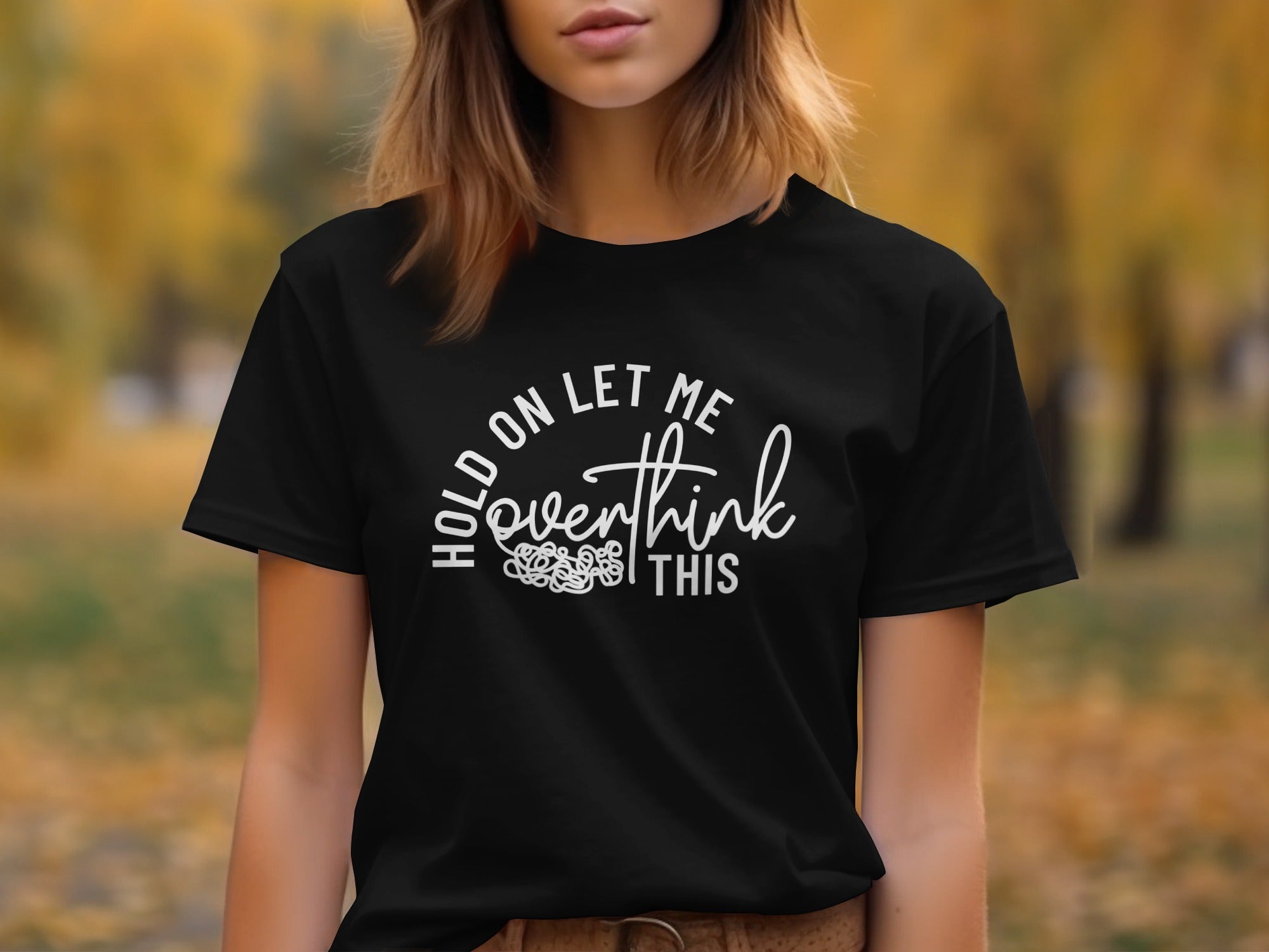 Black t-shirt with white text "Hold on let me overthink this".