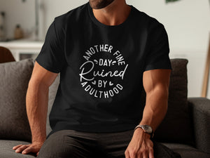 Black t-shirt with white text "Another Fine Day Ruined by Adulthood."