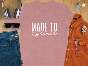 Rose pink t-shirt with white text "MADE TO Teach" and a heart.