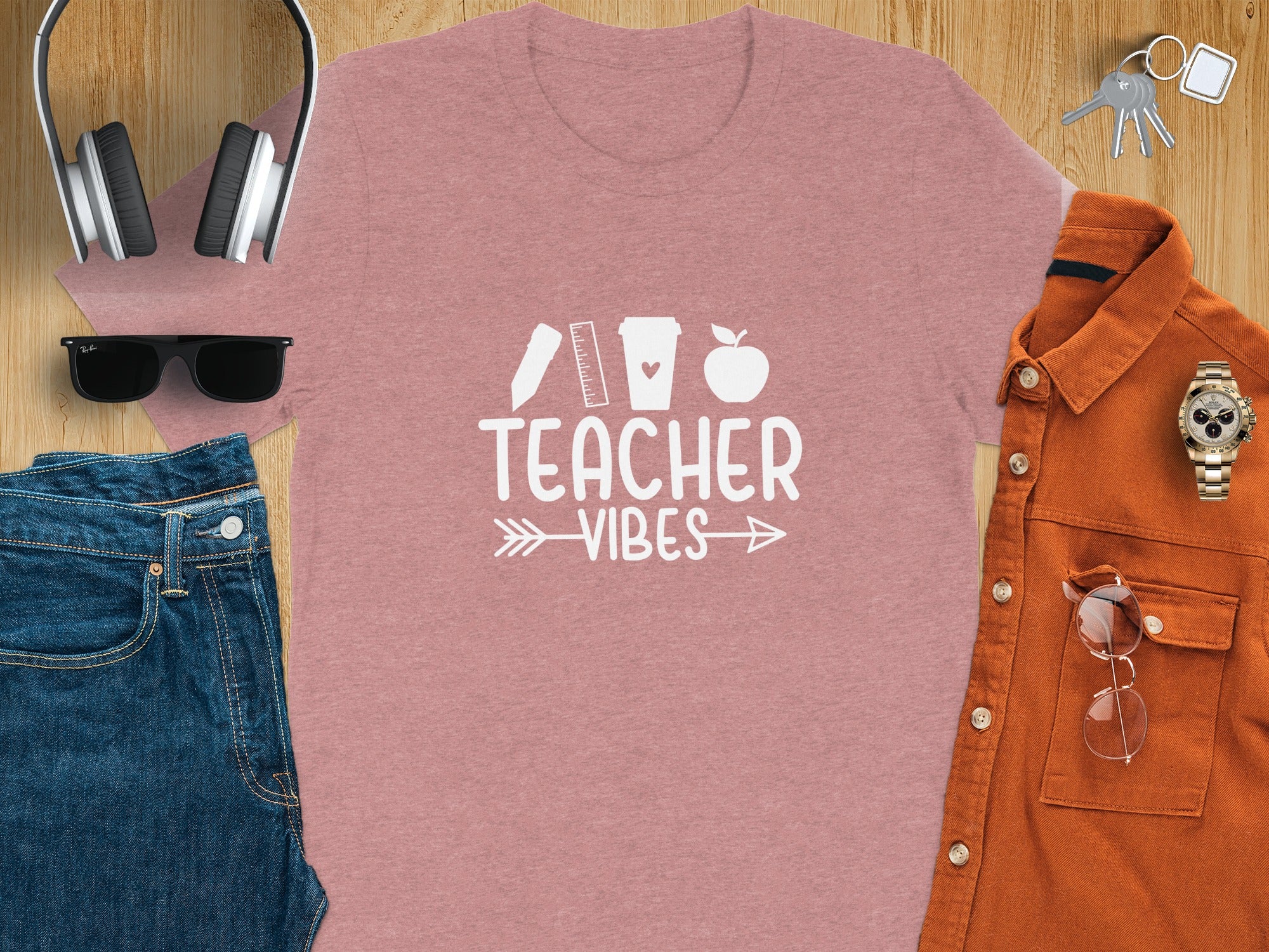 Pink t-shirt with "TEACHER VIBES" text and school icons.