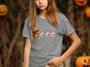 T-shirt graphic of fleeing dumplings from a treasure chest with a jack-o'-lantern background.