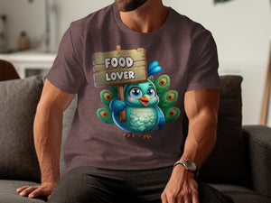 Cartoon peacock holding a "Food Lover" sign on a dark t-shirt.