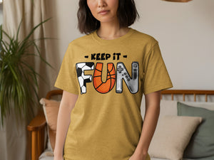 Yellow t-shirt with black text "KEEP IT" and stylized letters F-U-N.