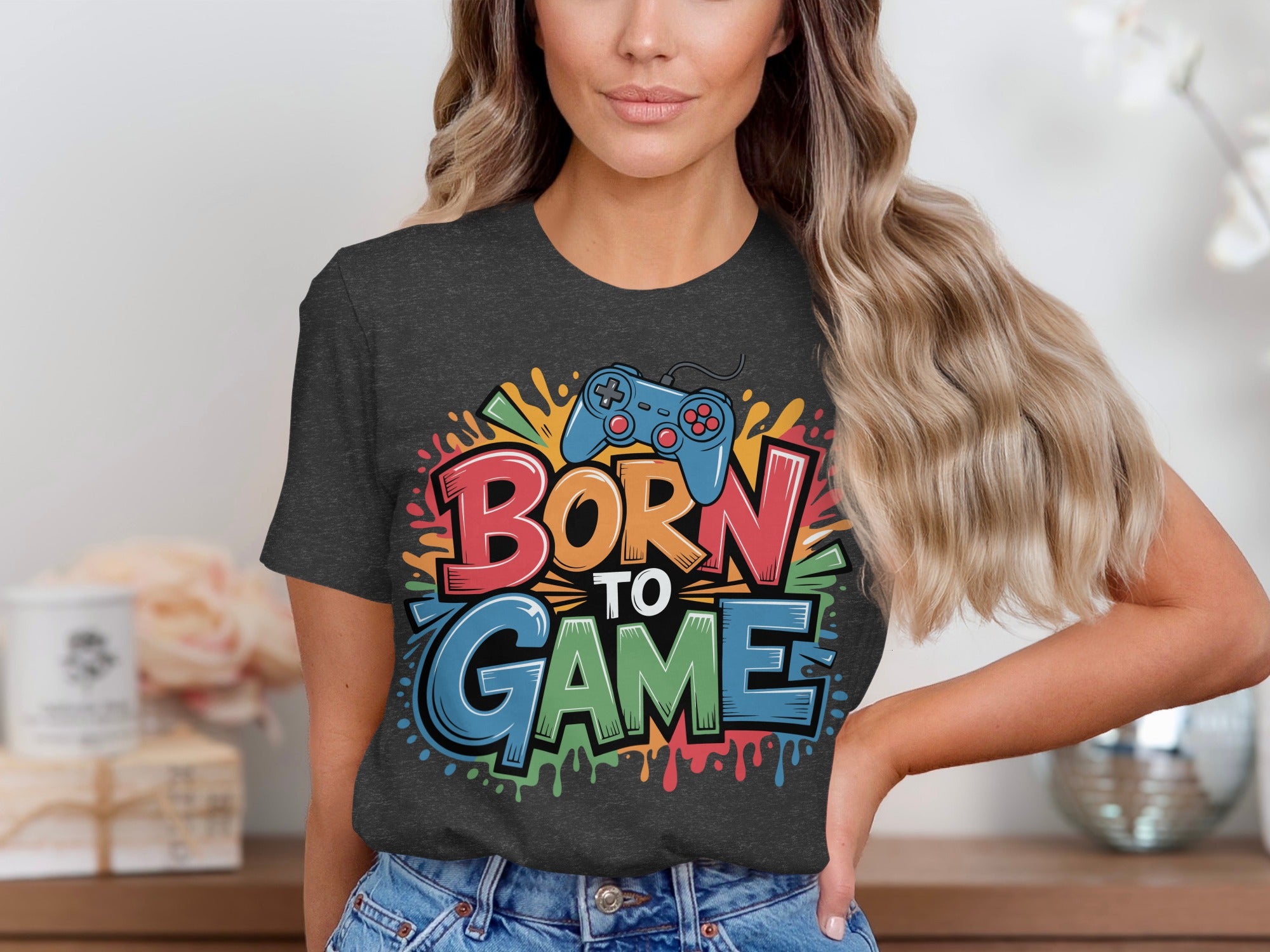 Dark t-shirt with "BORN TO GAME" text and a blue video game controller.