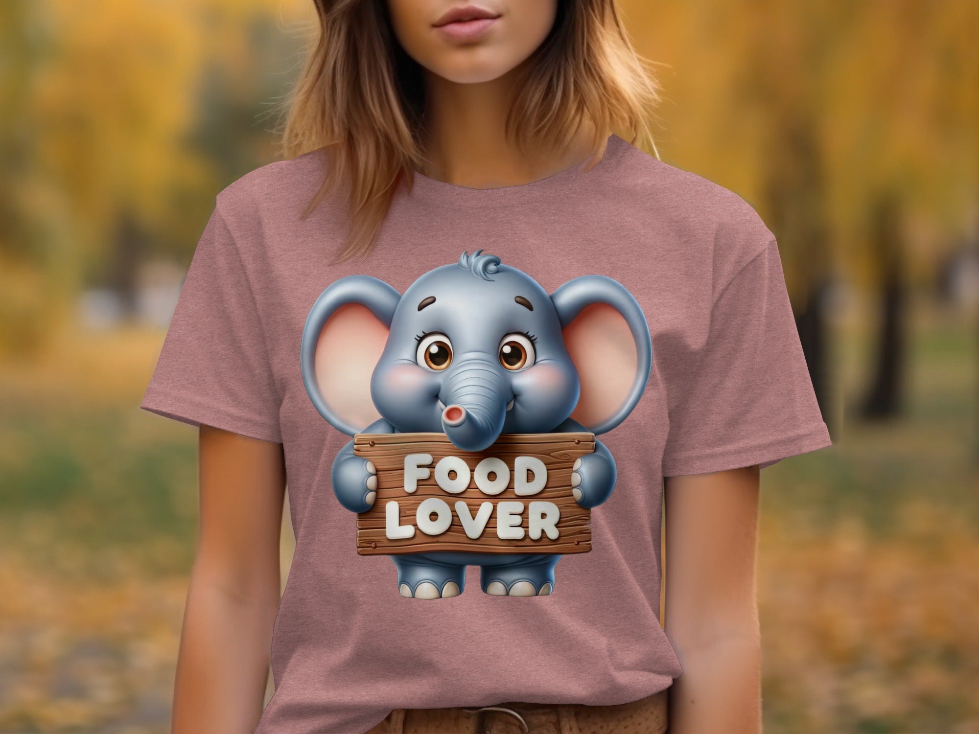 Cartoon elephant holding a wooden sign that says "FOOD LOVER".
