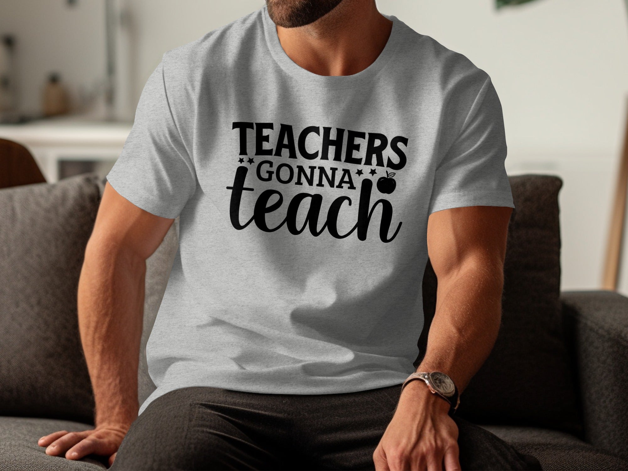 Light grey t-shirt with "Teachers Gonna Teach" text and apple graphic.