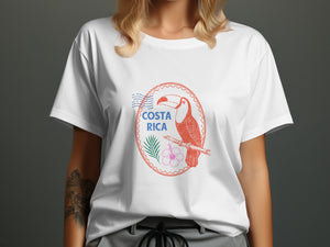 White t-shirt with "COSTA RICA" text and toucan, palm, and hibiscus emblem.